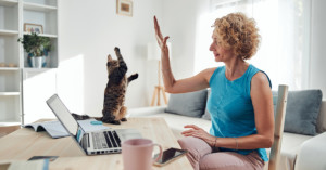 Woman and cat work from home