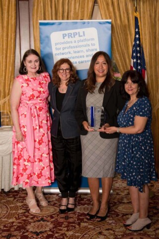 Photo of Nina McCann holding her Mentor Award with Hilary Topper, Theresa Jacobellis